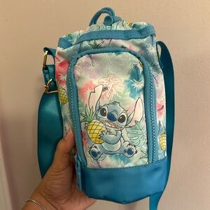 Crossbody water bottle bag. Has a pocket for card, money and many more. NWT